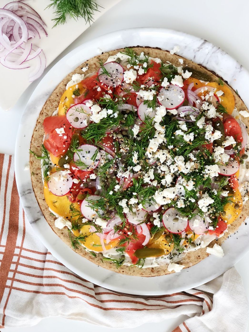 lox pizza with tartar sauce, capers, gherkins and feta cheese