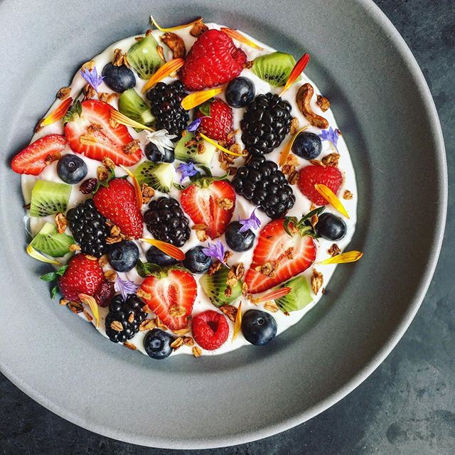 Yogurt Bowl With Fresh Fruit Granola And Edible Flowers The Feedfeed 