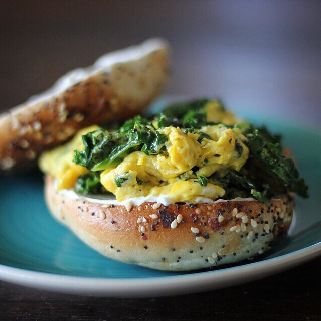 Buttery Scrambled Eggs And Kale On A Creamcheesy Everything Bagel