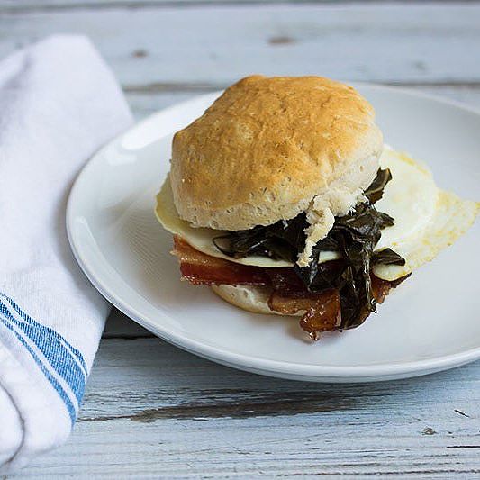 Maple Glazed Bacon, Collard Green And Fried Egg Biscuit Sandwich by