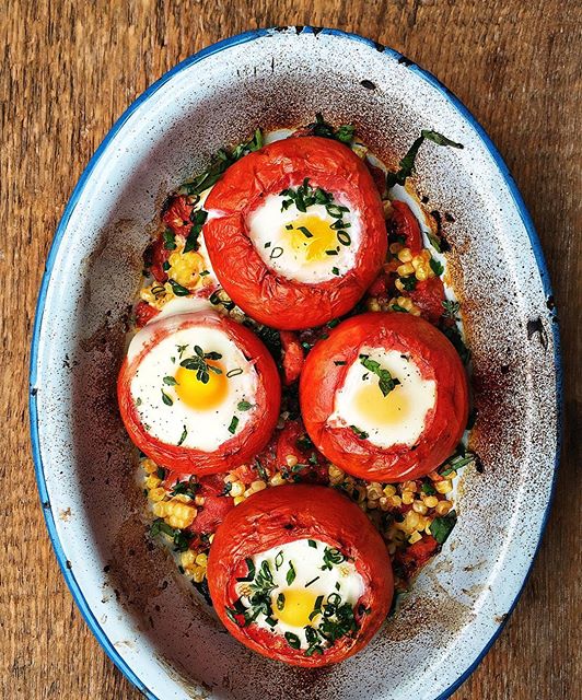 Baked Eggs In Roasted Tomatoes With Corn And Fresh Herbs by