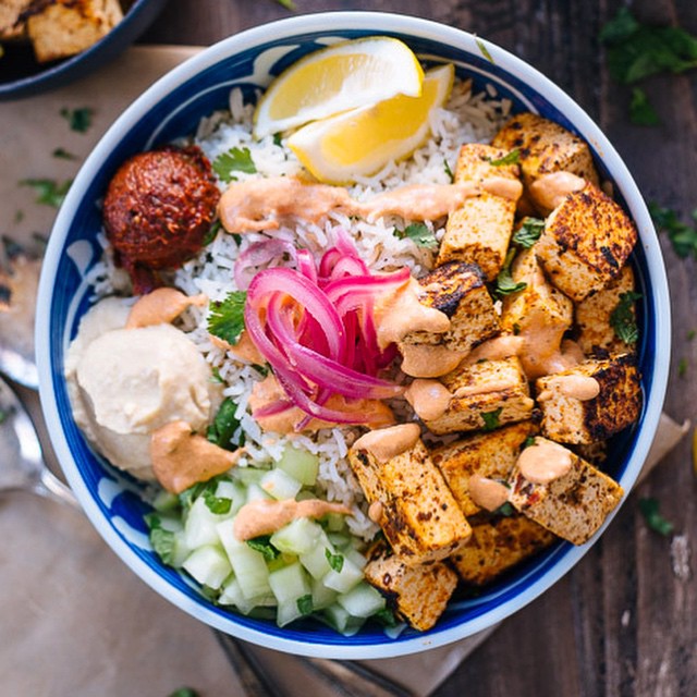 Spicy Tofu Rice Bowl With Hummus, Pickled Red Onion & Harissa Dressing