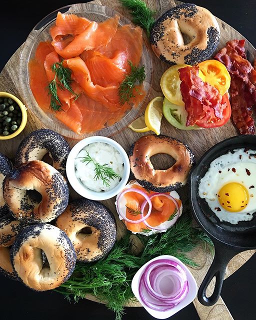 Bagels And Smoked Arctic Char With Cream Cheese, Fried Eggs, Red Onion, Fresh Dill, Sliced Tomatoes  And Capers