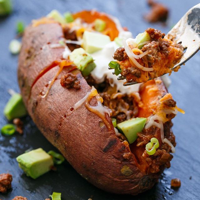 Beef Taco Stuffed Sweet Potatoes With Shredded Cheese And Sour Cream