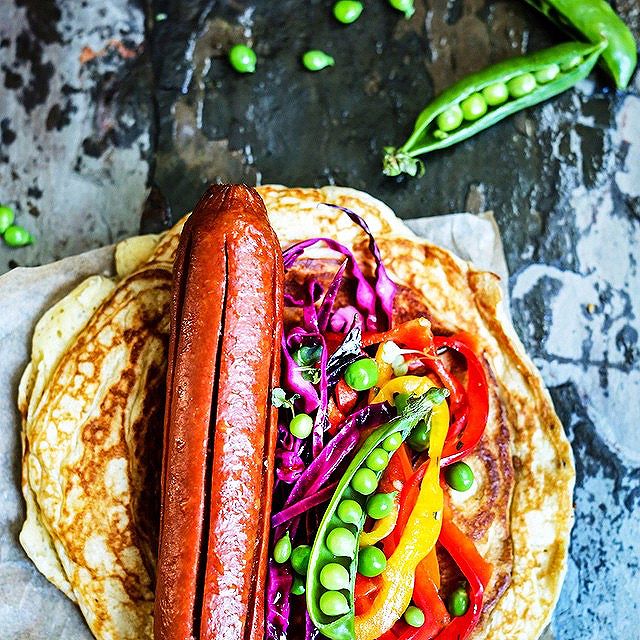 Hot Dog On Savory Pancake With Pickled Red Cabbage And Bell Pepper by