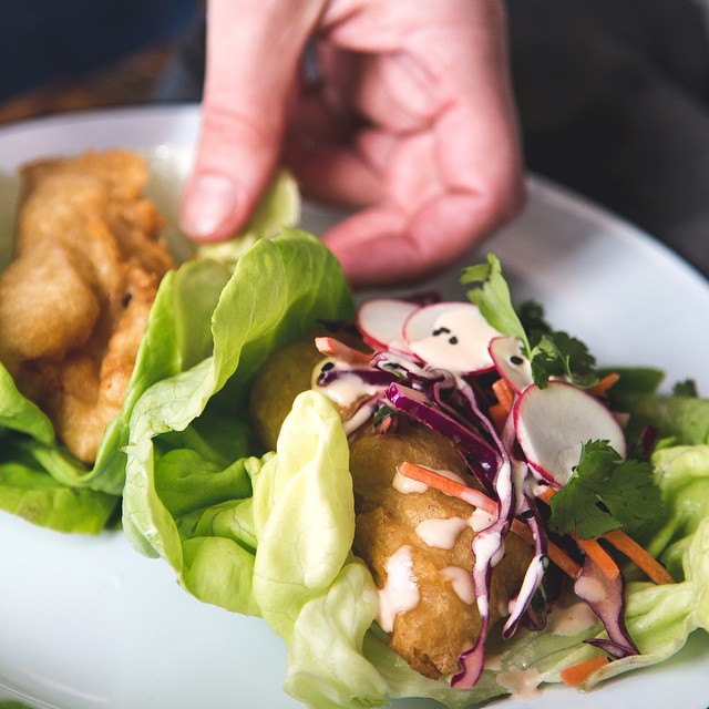 Beer Battered Fish Lettuce Wraps With Black Sesame Slaw & Spicy Crema