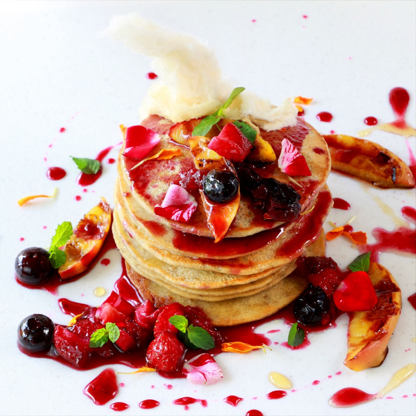 Pancakes with Roasted Peaches and Berry Sauce Recipe | The Feedfeed