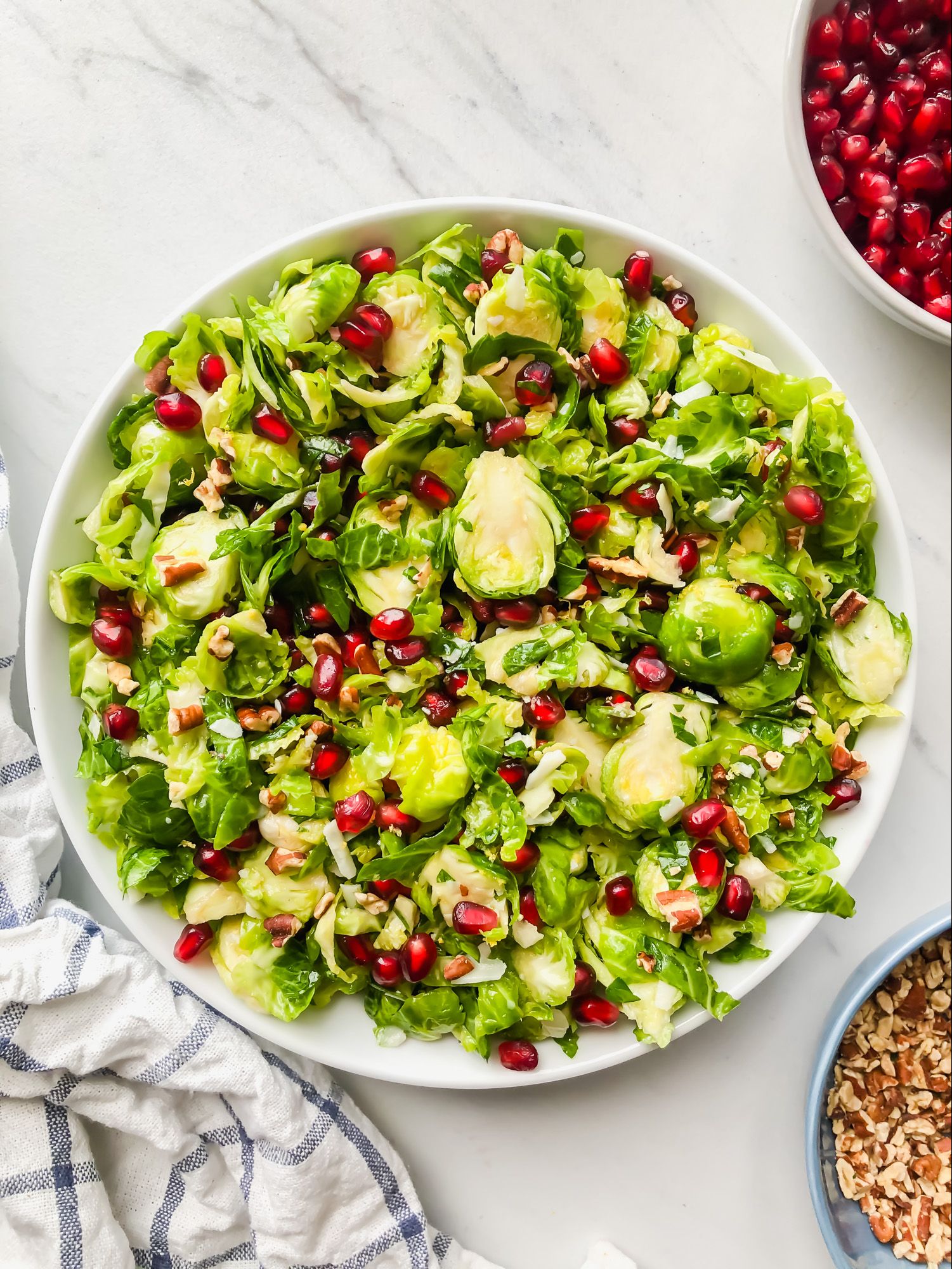 Shaved Brussels Sprout Salad With Parmesan And Pomegranate Recipe The Feedfeed