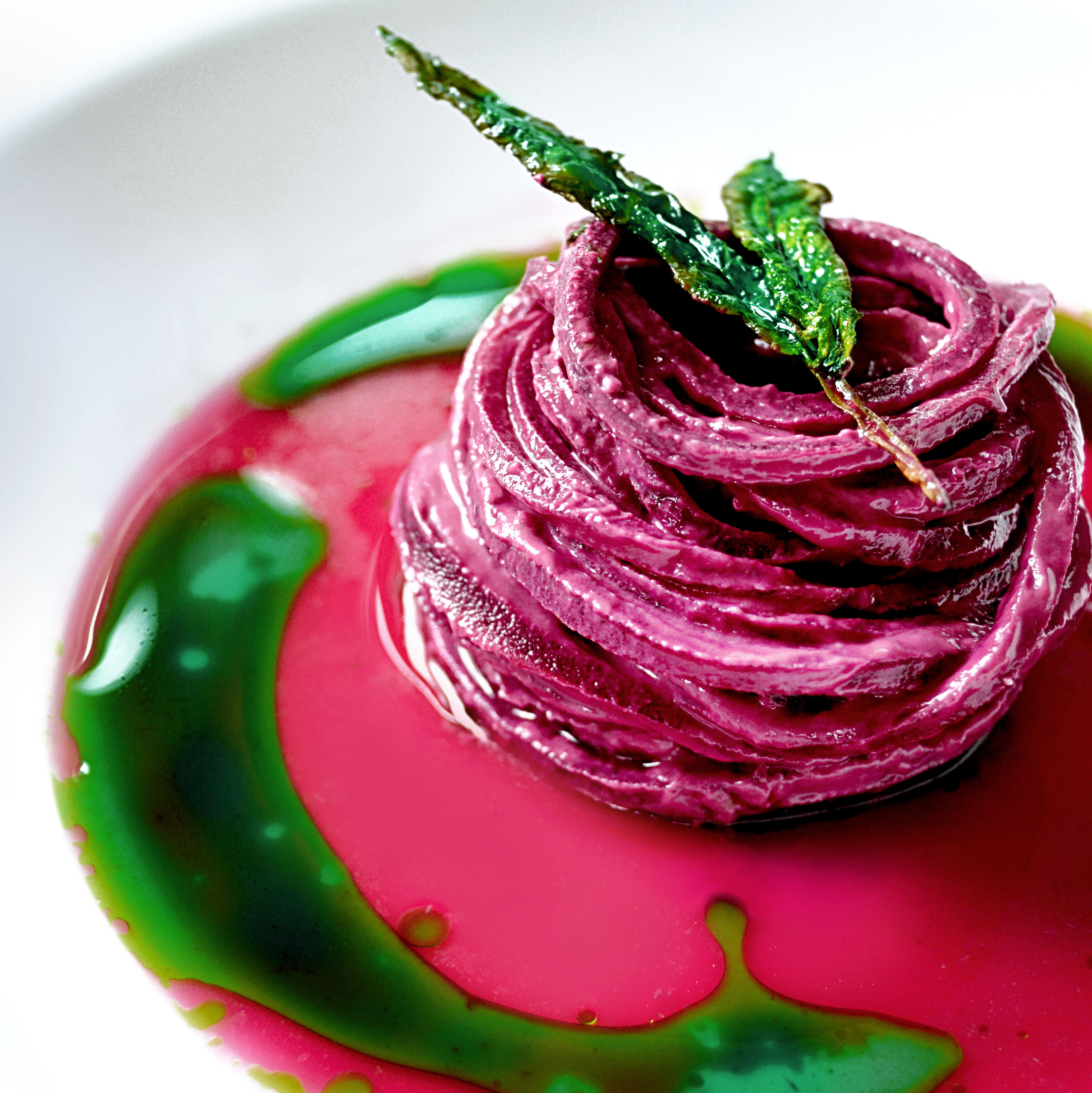 Seasoned beetroot Spaghetti coated in goats’ cheese, beet jus and