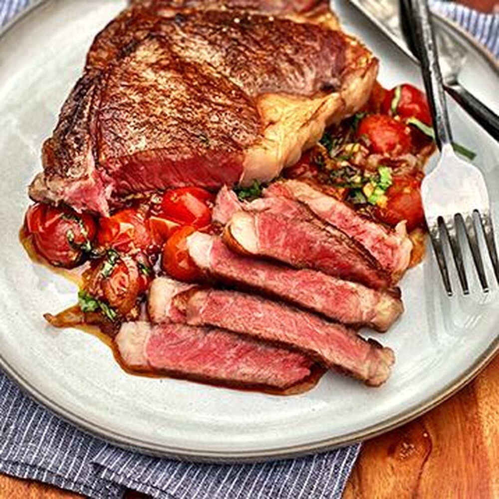 Pan Seared Wagyu Bone In Strip Steak With Tomato And Shallot Pan Sauce