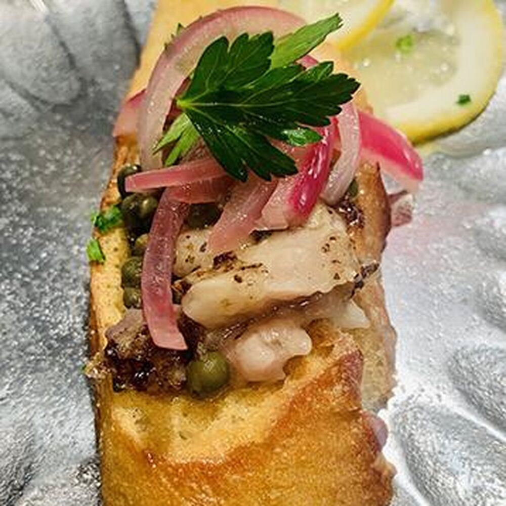 Wagyu Bone Marrow on Toast with Red Onion, Capers, and Lemon by