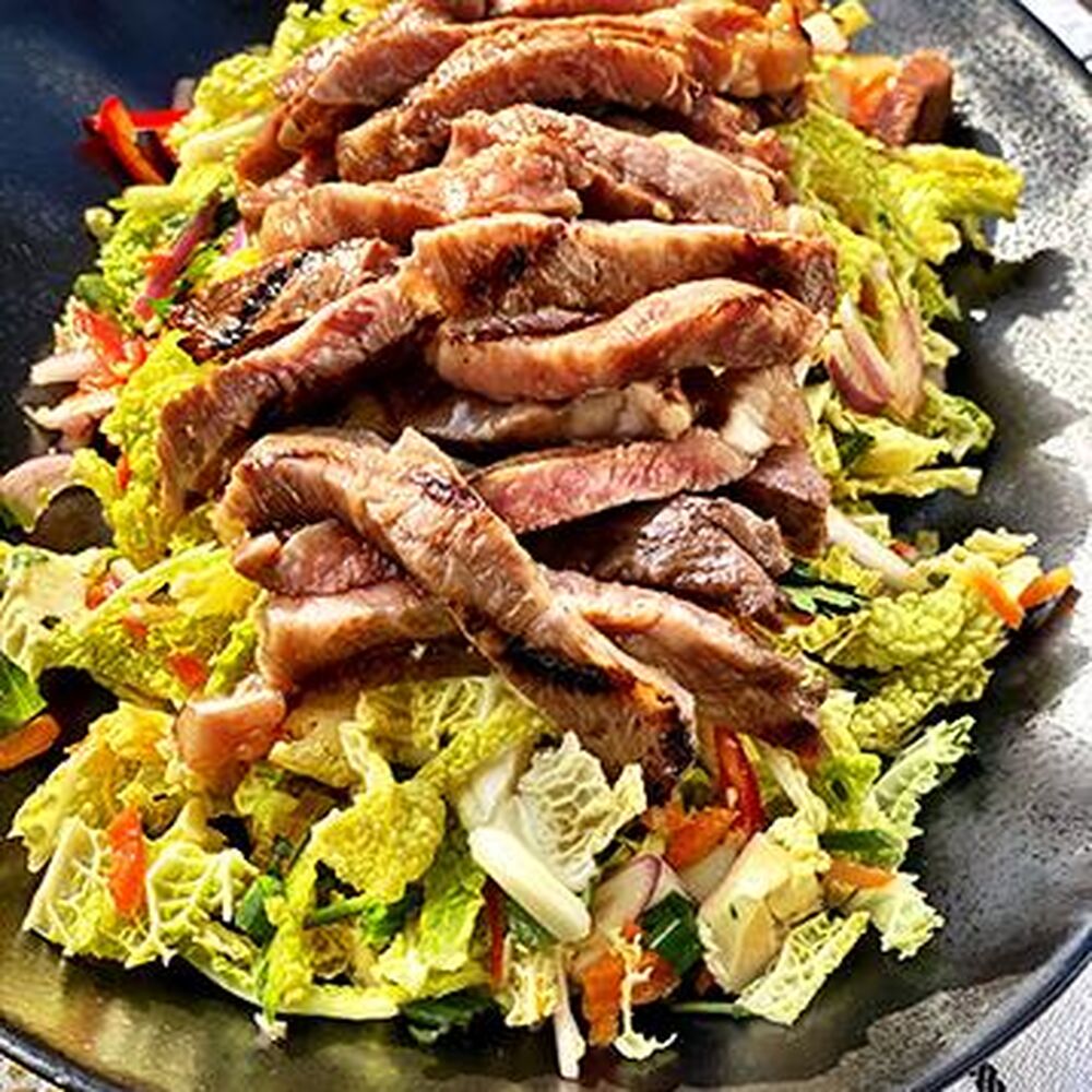 Grilled Wagyu Strip Steak Over Sweet and Spicy Jalapeno Slaw by