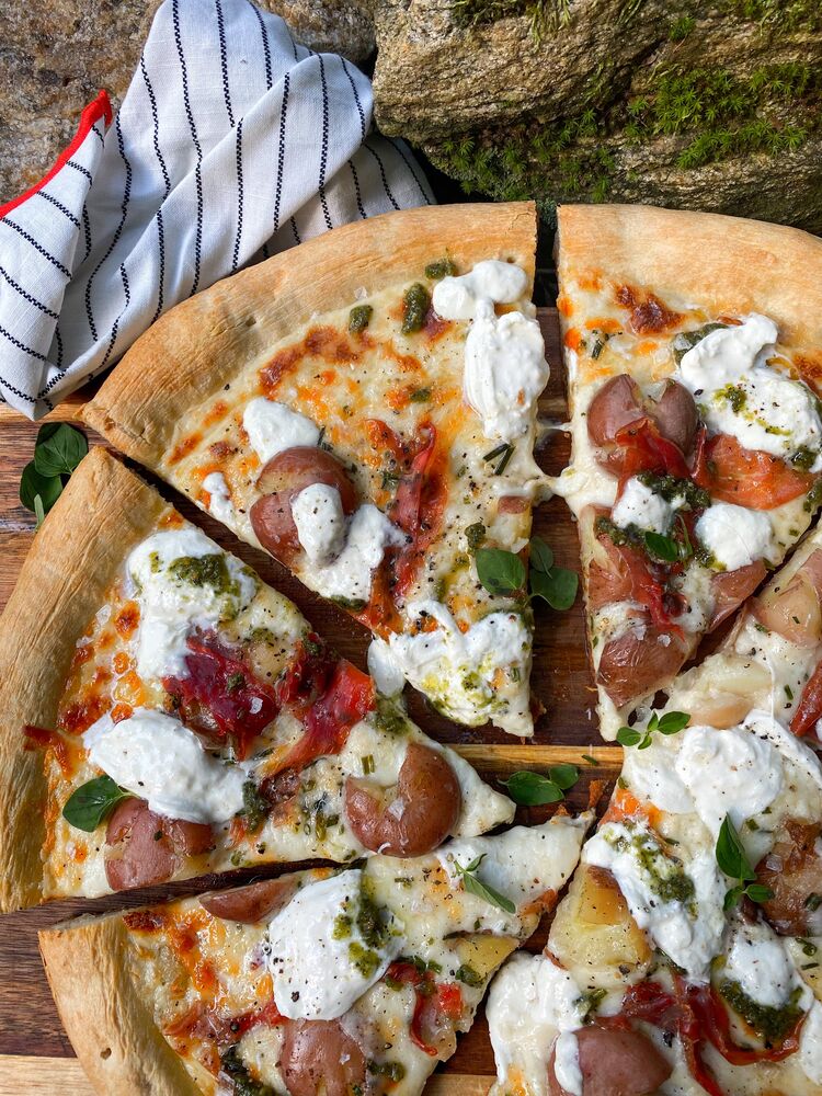 Cheesy potato, prosciutto and pesto pizza. Recipe The Feedfeed